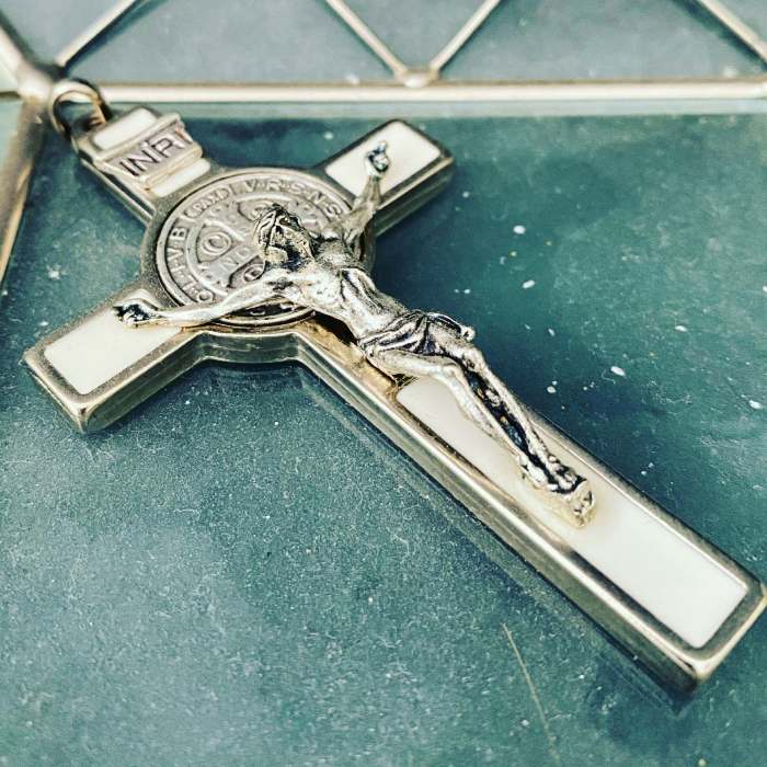 silver key on blue textile
